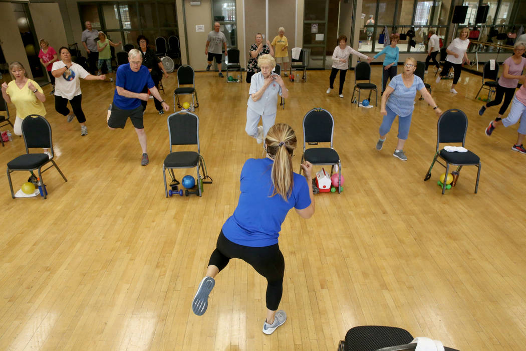 Anita Stephens teaches a Body Flow class as part of the SilverSneakers fitness program at Duran ...