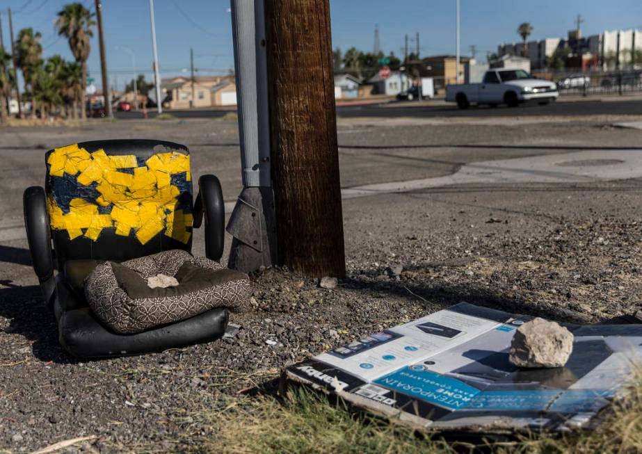 Discarded furniture and empty boxes lay in a field close to the intersection of South Las Vegas ...