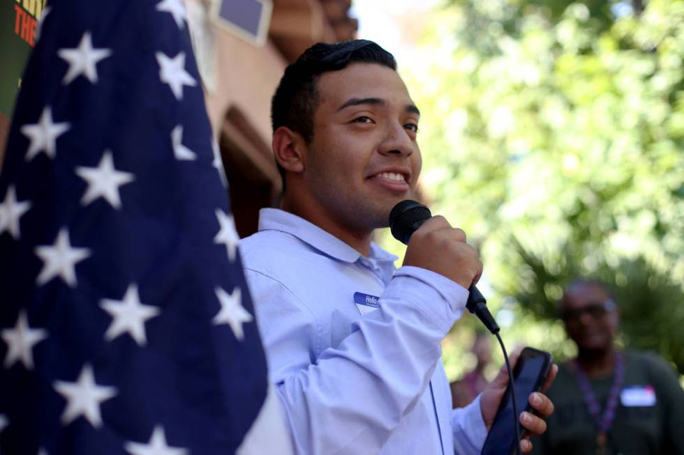 Andrew Sierra addresses guests at a meet-n-greet with campaign staff at the new office for Kama ...