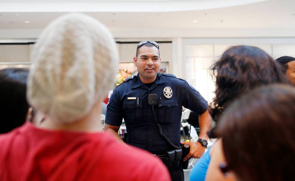 Clark County School District police officer Bernardo Abarca speaks with new CCSD students durin ...