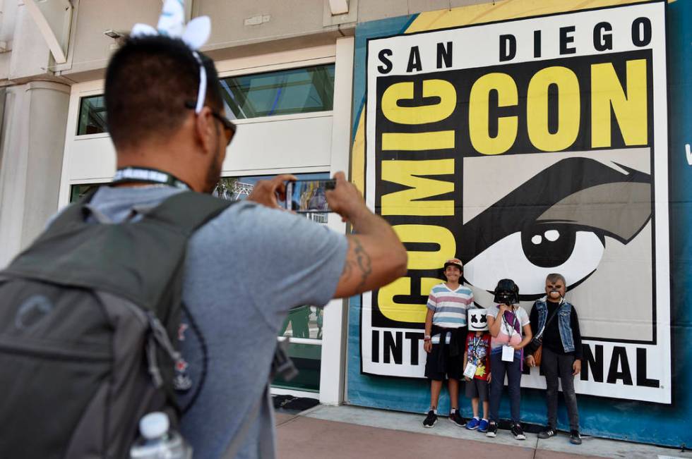 FILE - In this Wednesday, July 18, 2018, file photo, Luis Ramos, left, of San Diego takes a pic ...