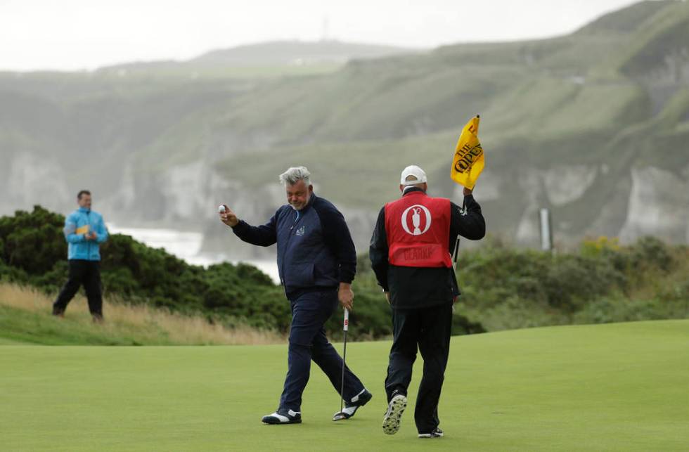 Northern Ireland's Darren Clarke acknowledges the crowd after getting a birdie on the 5th green ...