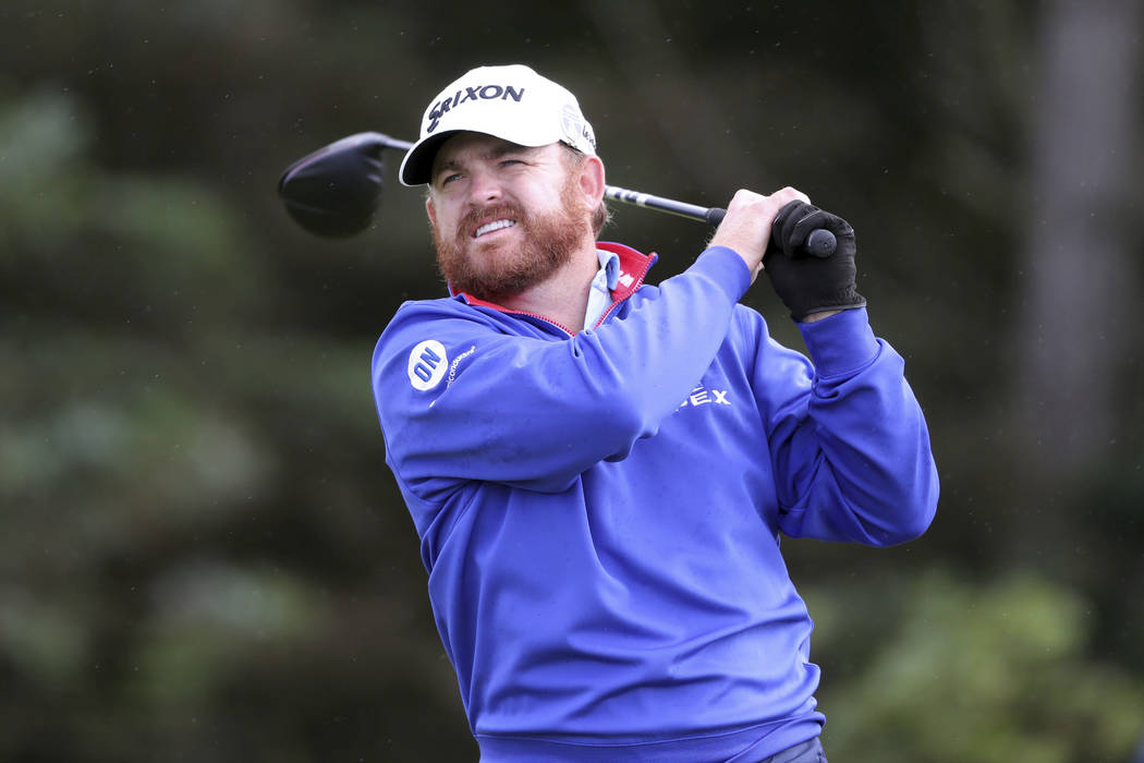 JB Holmes of the US plays off the 5th tee during the first round of the British Open Golf Champ ...