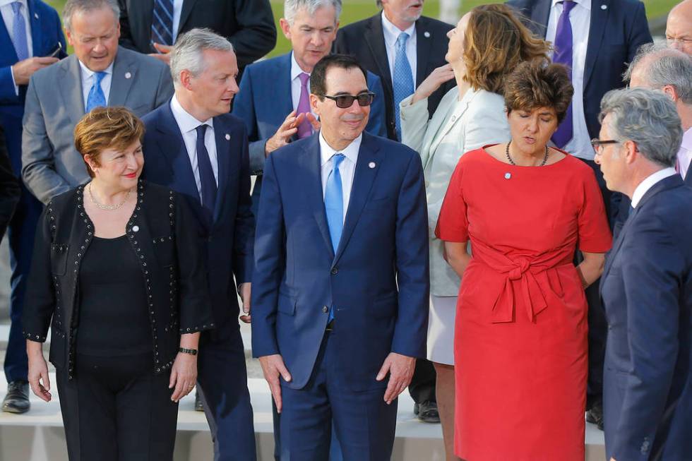 US Treasury Secretary Steve Mnuchin, front center, stands next to Chief Executive of the World ...