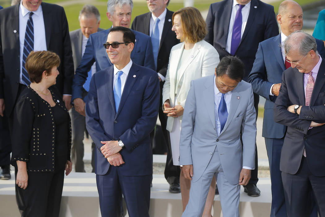 US Treasury Secretary Steve Mnuchin, second left, talks to Chief Executive of the World Bank Kr ...