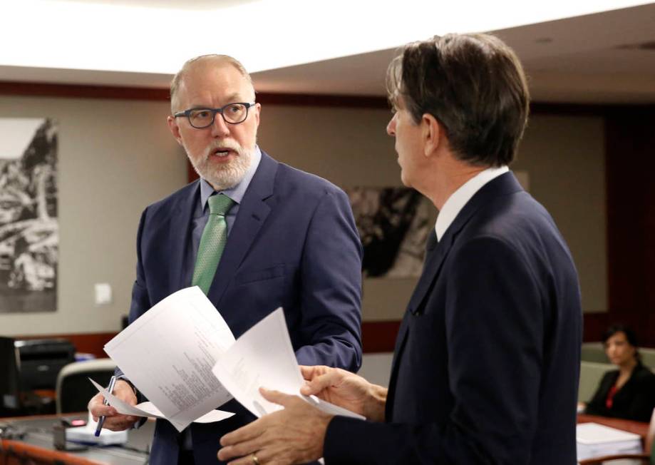 Attorneys representing MGM Resorts International, Todd Bice, left, and Michael Doyen discuss in ...