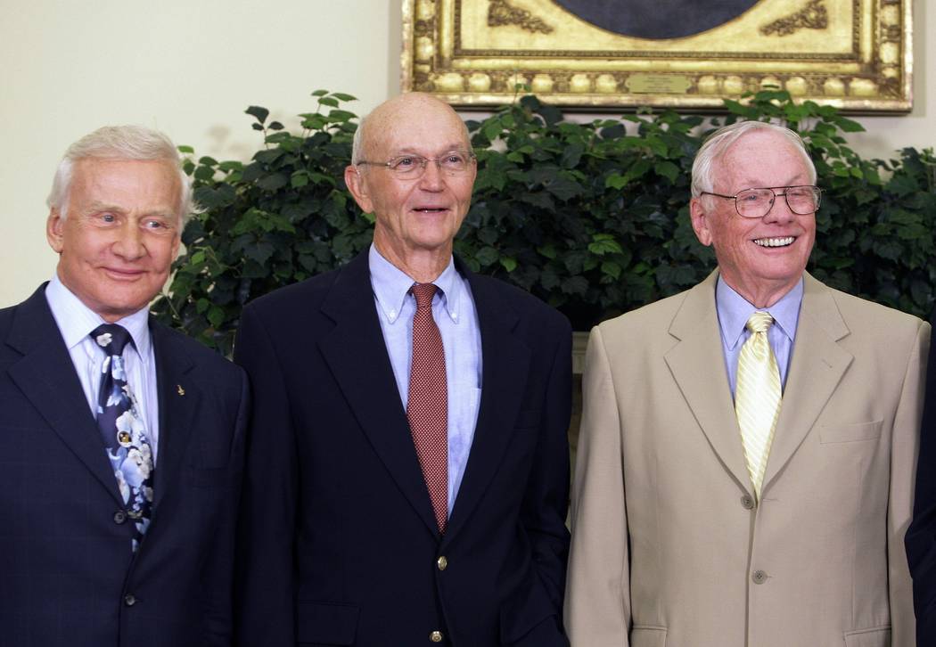 Apollo 11 astronauts, from left, Buzz Aldrin, Michael Collins and Neil Armstrong stand in the O ...