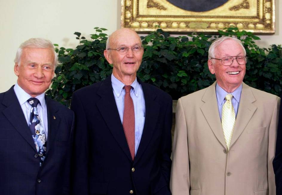 Apollo 11 astronauts, from left, Buzz Aldrin, Michael Collins and Neil Armstrong stand in the O ...