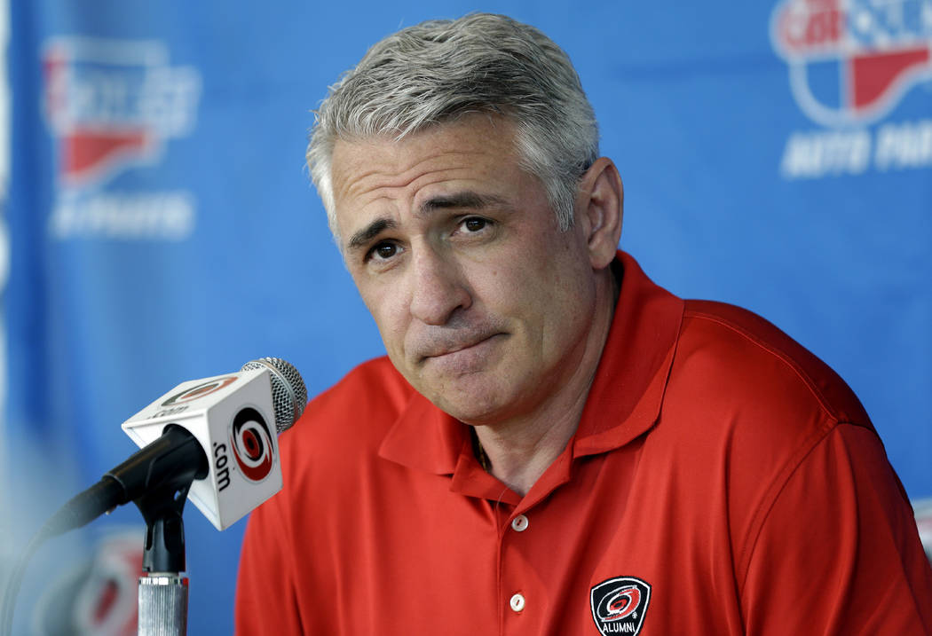 Ron Francis, at the time the general manager of the Carolina Hurricanes, takes questions from m ...