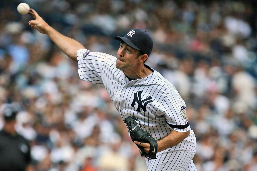 New York Yankees' Mike Mussina pitches during the sixth inning of a baseball game against the K ...