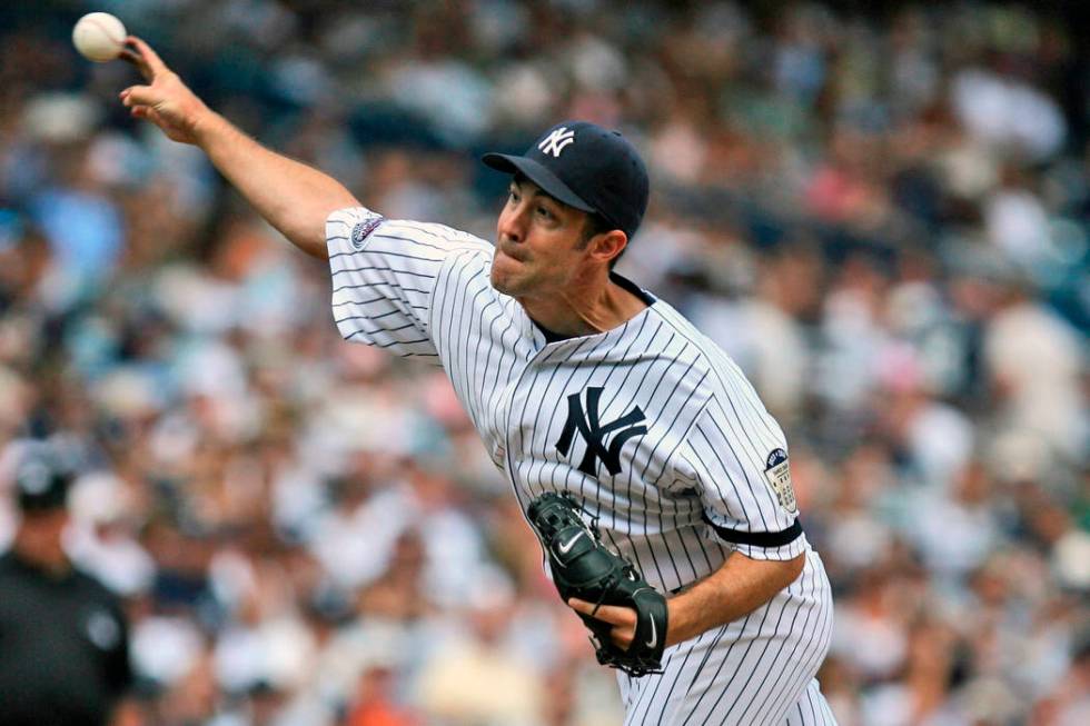 New York Yankees' Mike Mussina pitches during the sixth inning of a baseball game against the K ...