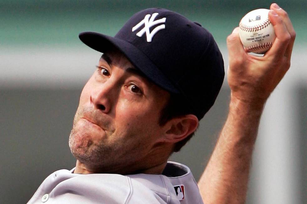 New York Yankees starting pitcher Mike Mussina delivers to the Boston Red Sox during the first ...