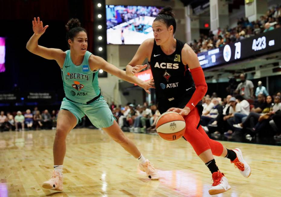 New York Liberty's Kia Nurse, left, defends against Las Vegas Aces' Kayla McBride in the second ...