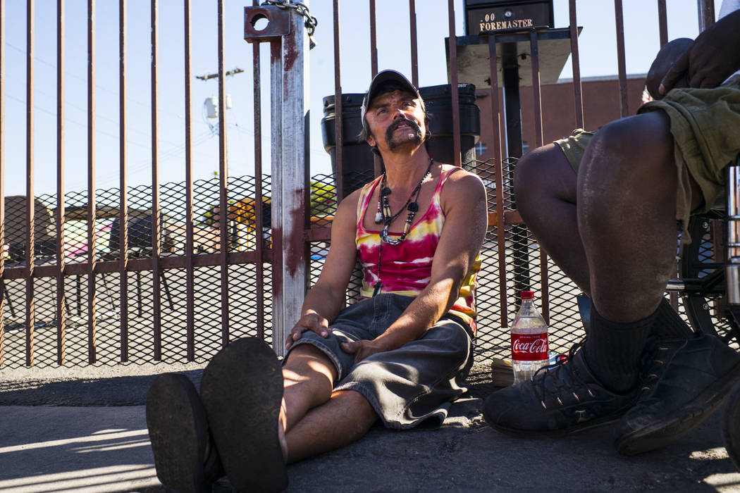 John Bell talks about living homeless while waiting in line for food on Foremaster Lane near do ...