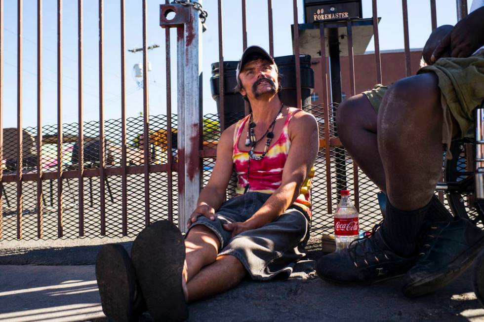 John Bell talks about living homeless while waiting in line for food on Foremaster Lane near do ...