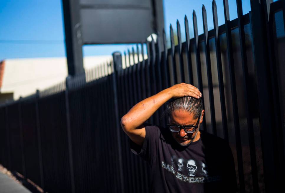 Brian Diaz talks about living homeless while waiting in line for food on Foremaster Lane near d ...