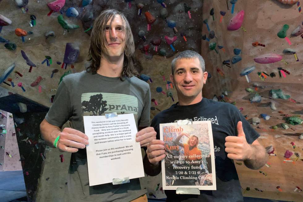 Nevada Climbing Center manager Ryan Lawrence, left, and volunteer Dave Campbell, right, hold up ...