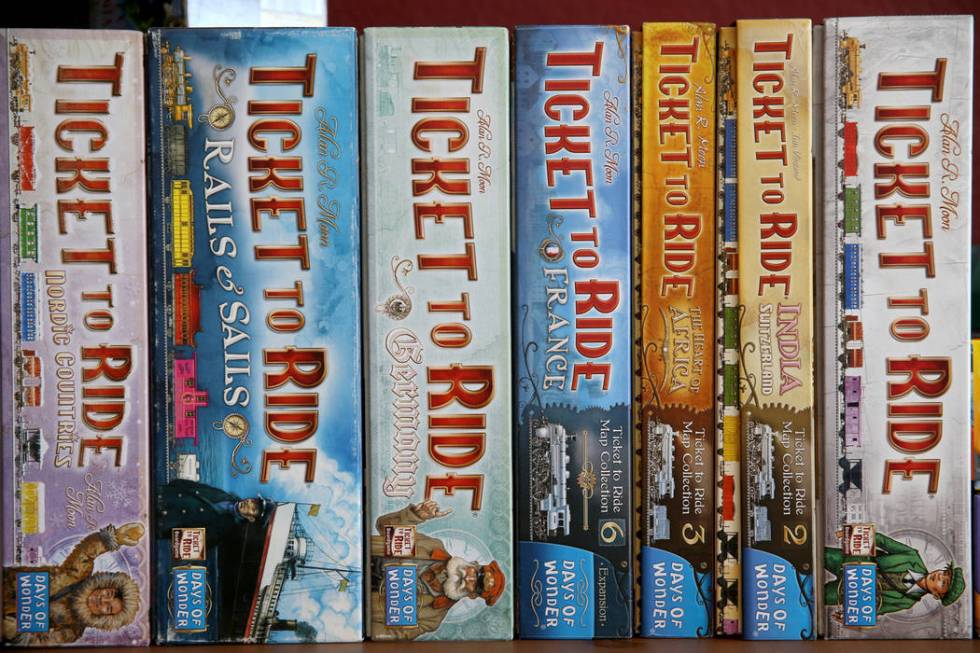 A variety of the game "Ticket to Ride" at Boarding School Games in Las Vegas, owned b ...