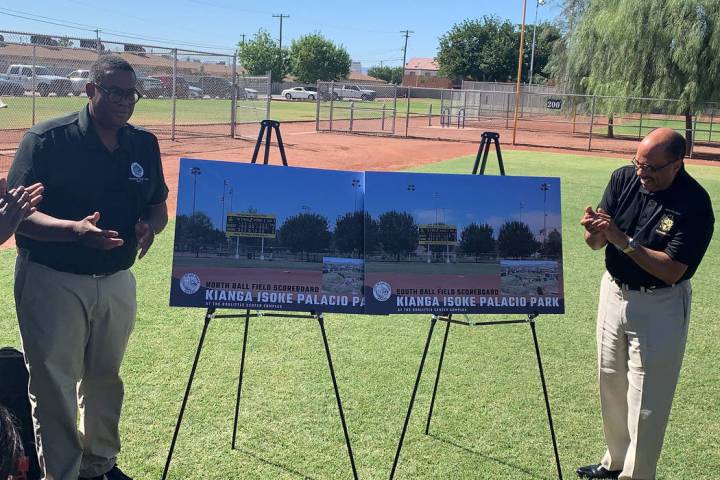 Councilman Cedric Crear, left, unveils what the new scoreboards at Kianga Isoke Palacio Park wi ...