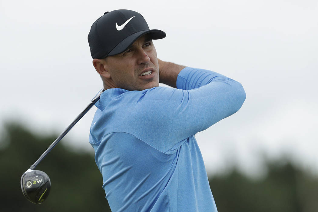 Brooks Koepka of the United States plays his tee shot on the 12th hole during the third round o ...