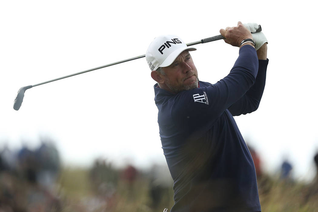 England's Lee Westwood plays his tee shot on the 8th hole during the third round of the British ...