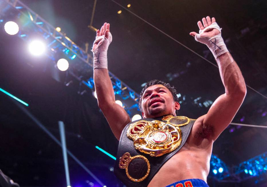 Manny Pacquiao greets and thanks the fans after defeating Keith Thurman in their WBA super welt ...