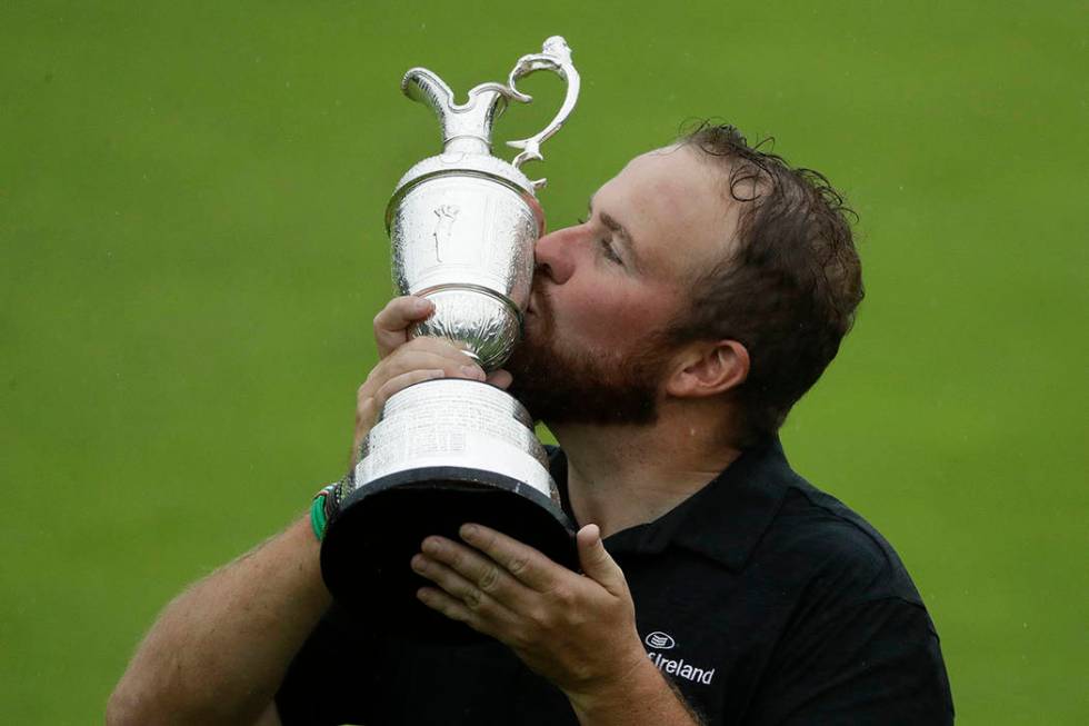 Ireland's Shane Lowry holds and kisses the Claret Jug trophy after winning the British Open Gol ...