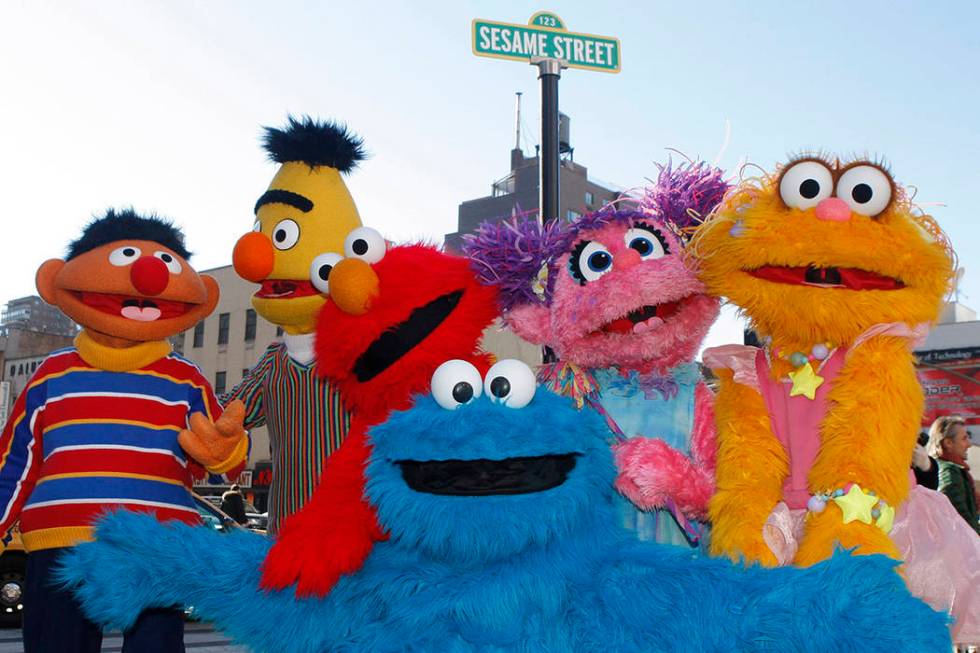 FILE - In this Feb. 10, 2010 file photo, characters from Sesame Street Live appear on the stree ...