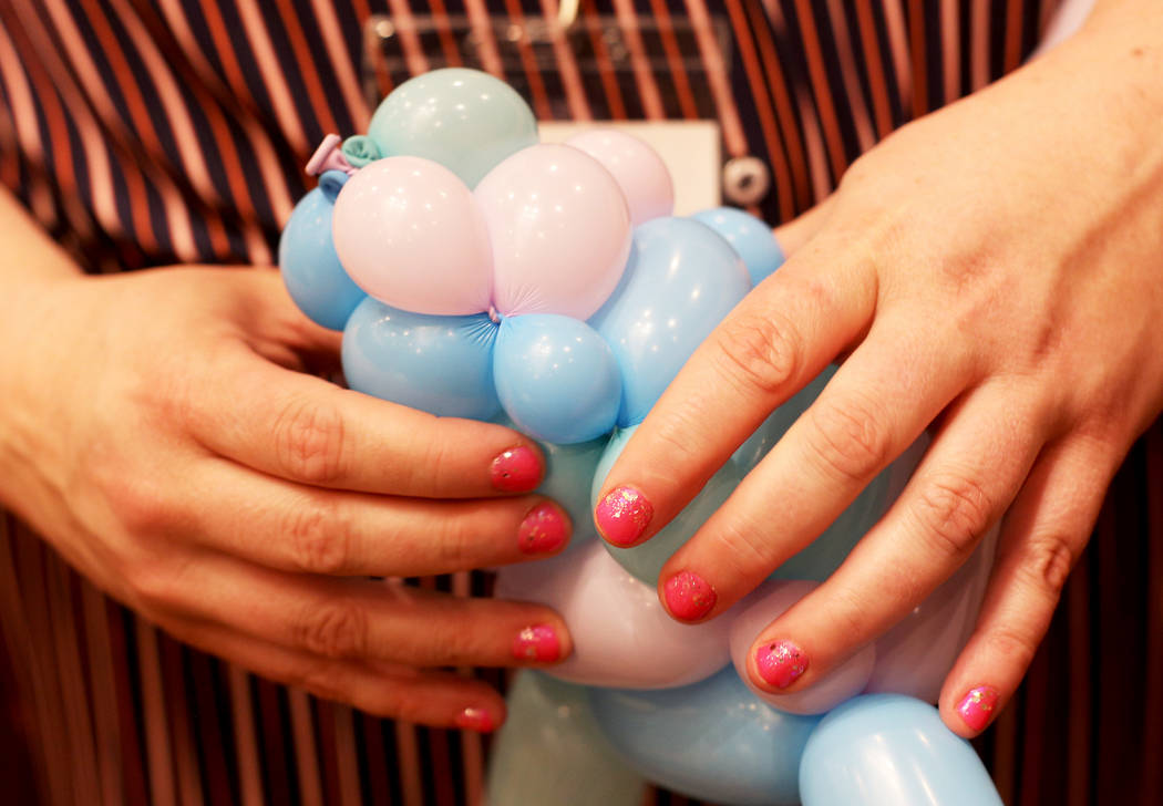 Becky Killoran of Canada plays with balloon twisting at the Bling Bling Balloon Jam convention ...