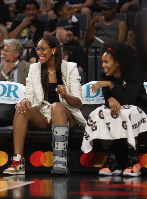 Las Vegas Aces forward A'ja Wilson, left, cheers on her team with fellow Aces forward Tamera Yo ...