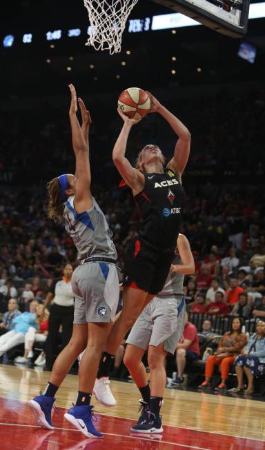 Las Vegas Aces forward Dearica Hamby (5) attempts a layup against Minnesota Lynx forward Naphee ...