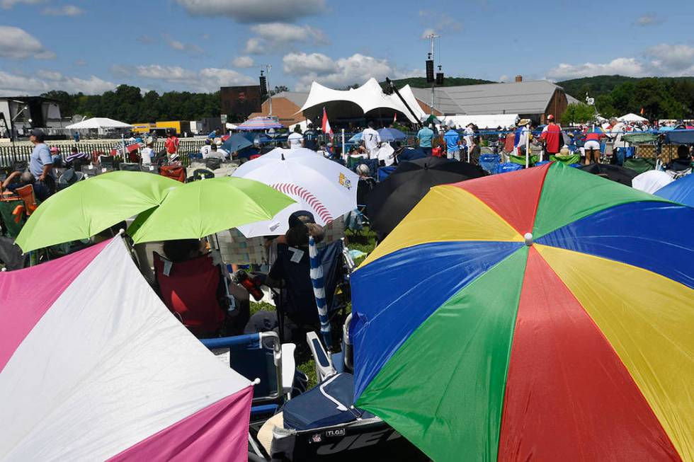 Fans wait for the National Baseball Hall Of Fame induction ceremony at the Clark Sports Center ...