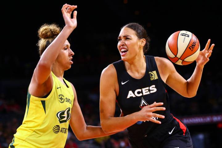 Las Vegas Aces' Liz Cambage moves the ball against Seattle Storm's Mercedes Russell during the ...