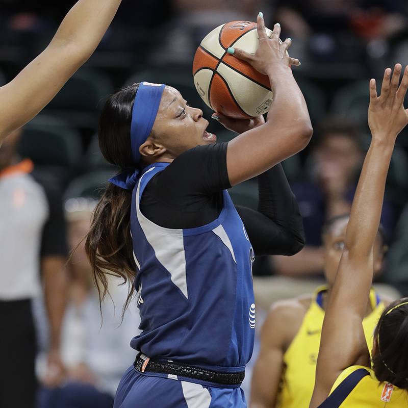 Minnesota Lynx's Odyssey Sims (1) shoots over Indiana Fever's Kelsey Mitchell (0) during the fi ...