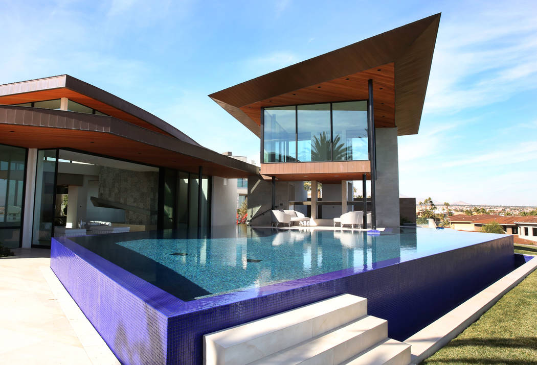 A swimming pool with Zen room, right top, and the master bedroom, left, are seen at the home of ...