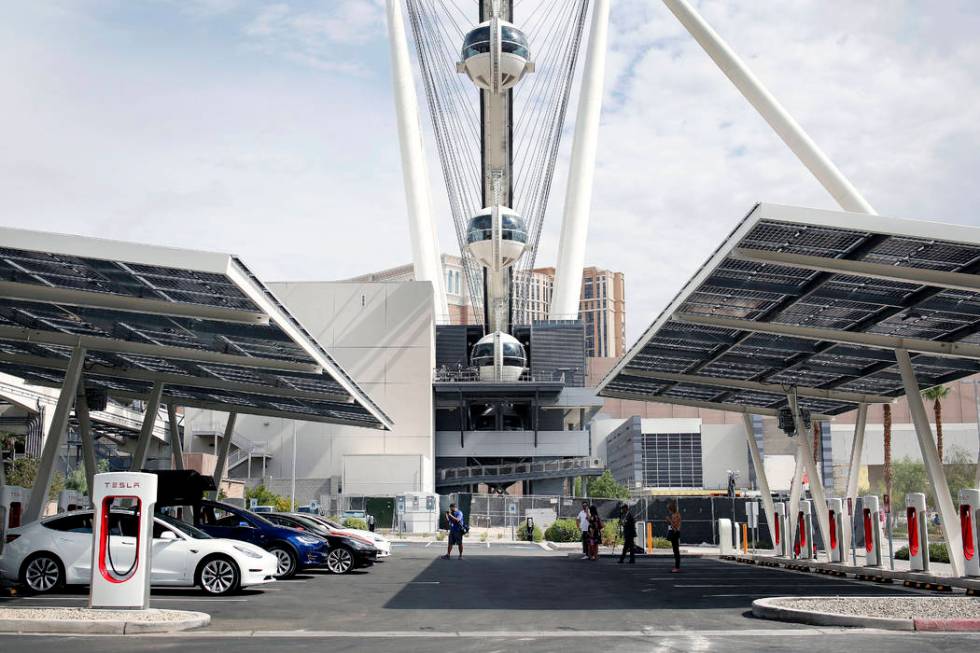 Teslas are charging at Tesla's largest Supercharger station now open near the High Roller in La ...