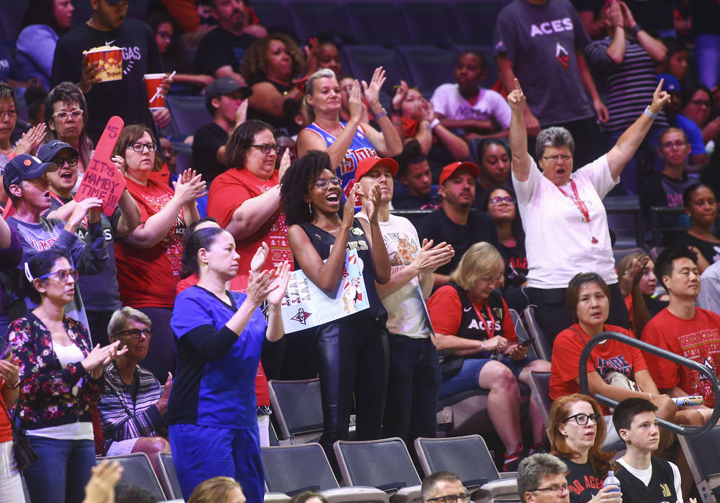 Las Vegas Aces fans cheer during the second half of a WNBA basketball game against Seattle Stor ...