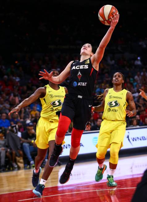 Las Vegas Aces' guard Kelsey Plum (10) goes to the basket against the Seattle Storm during the ...