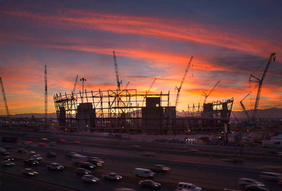 The sun sets behind the under-construction Las Vegas Stadium in Las Vegas on Wednesday, Dec. 19 ...