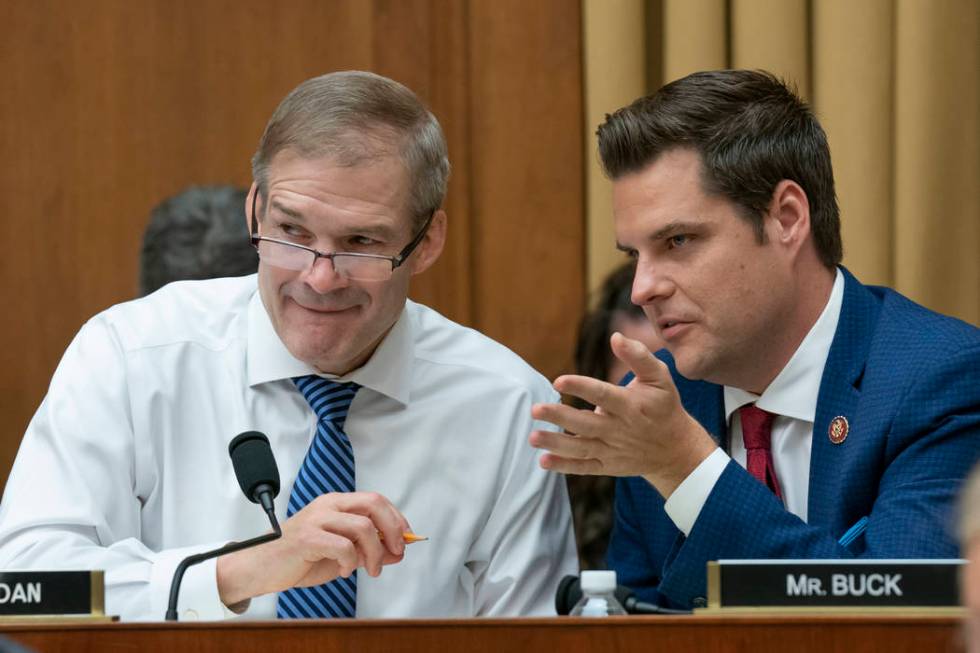 Rep. Jim Jordan, R-Ohio, left, and TALKS with Rep. Matt Gaetz, R-Fla., right, as former special ...