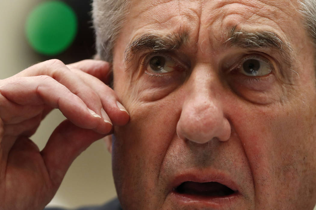 Former special counsel Robert Mueller testifies before the House Intelligence Committee hearing ...