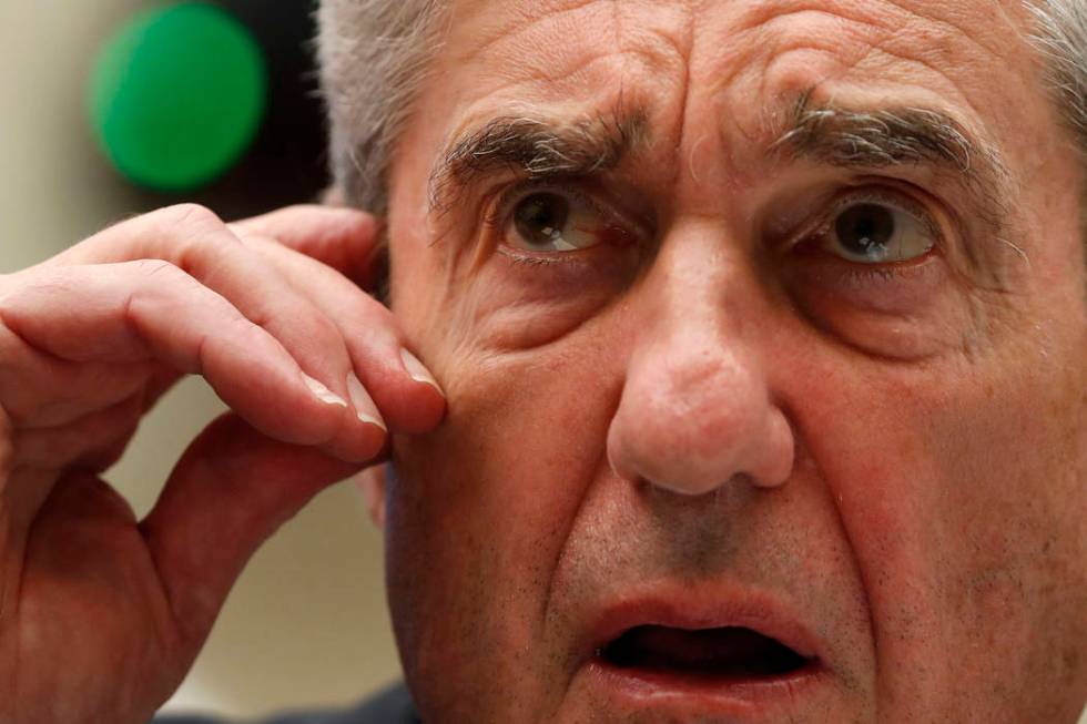 Former special counsel Robert Mueller testifies before the House Intelligence Committee hearing ...