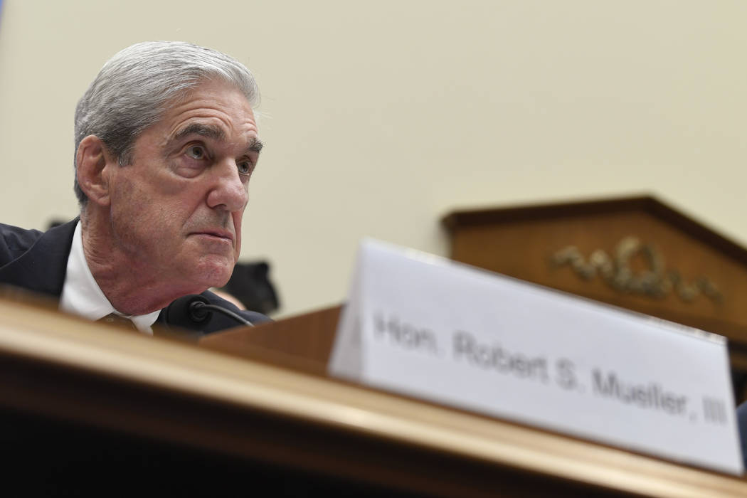 Former special counsel Robert Mueller testifies before the House Intelligence Committee on Capi ...