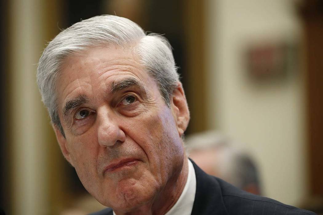 Former special counsel Robert Mueller listens as he testifies before the House Judiciary Commit ...