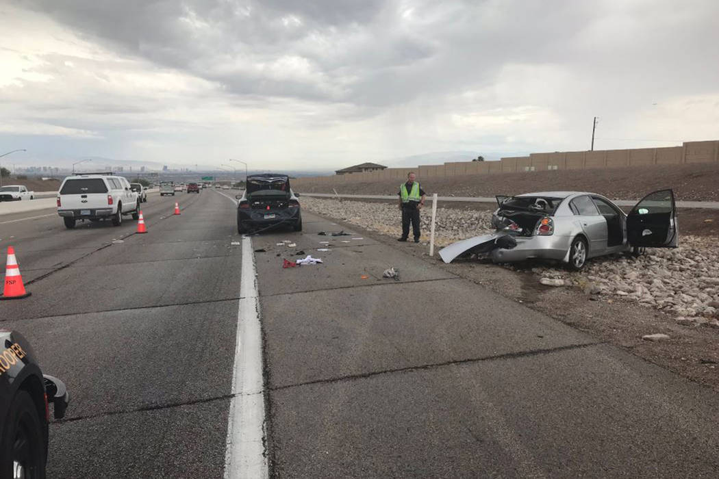 A Nevada Highway Patrol vehicle with a trooper inside was struck by another vehicle on northbou ...