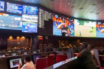 Bettors watch live sports at the CG Technology sportsbook at the Palms in Las Vegas, Thursday, ...