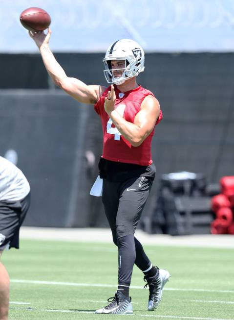 Oakland Raiders quarterback Derek Carr (4) throws the football during a mandatory mini-camp wor ...