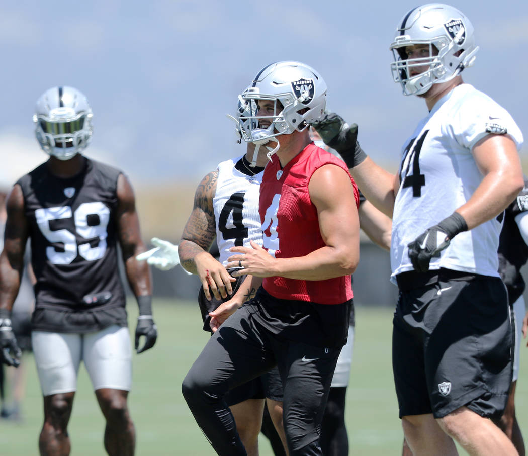 Oakland Raiders outside linebacker Tahir Whitehead (59) and offensive tackle Kolton Miller (74) ...