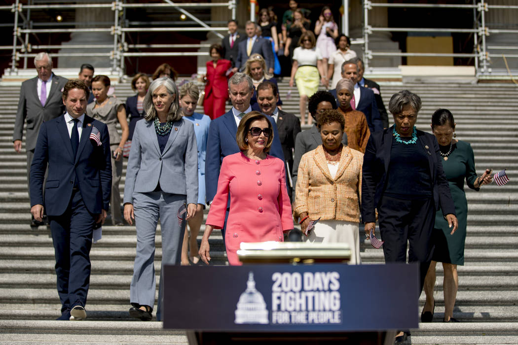 House Speaker Nancy Pelosi of Calif. and House Democrats arrive for a news conference on the fi ...