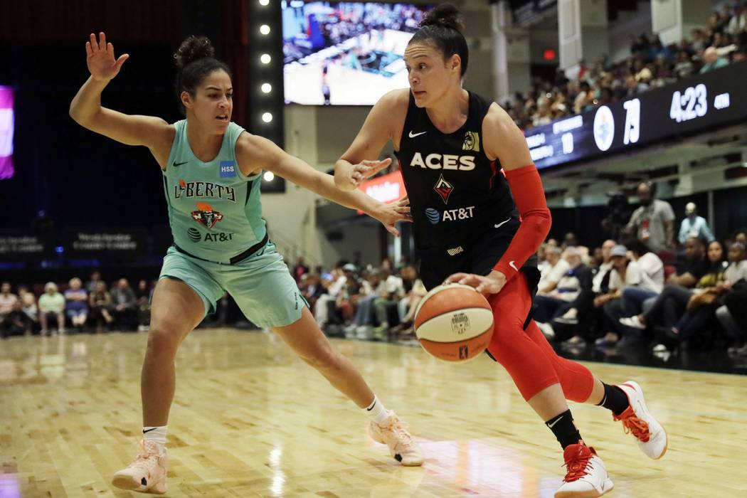 New York Liberty's Kia Nurse, left, defends against Las Vegas Aces' Kayla McBride in the second ...